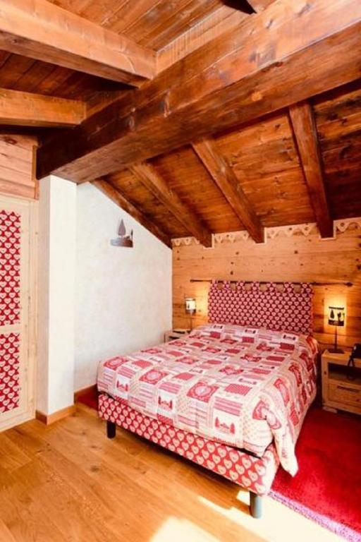 Postel nebo postele na pokoji v ubytování Chalets Mignon