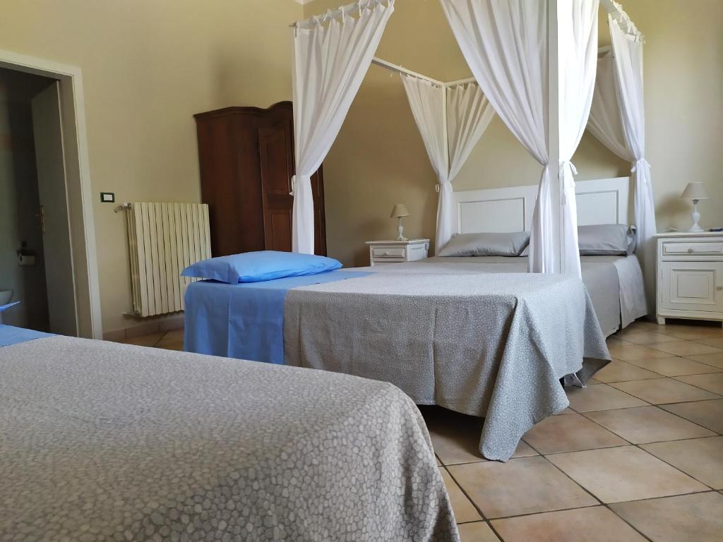 Postel nebo postele na pokoji v ubytování B&B Li Ccoti