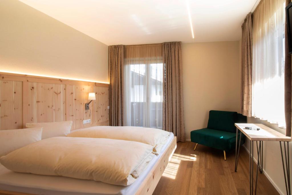 Postel nebo postele na pokoji v ubytování Bed&Breakfast Pension Hilpold