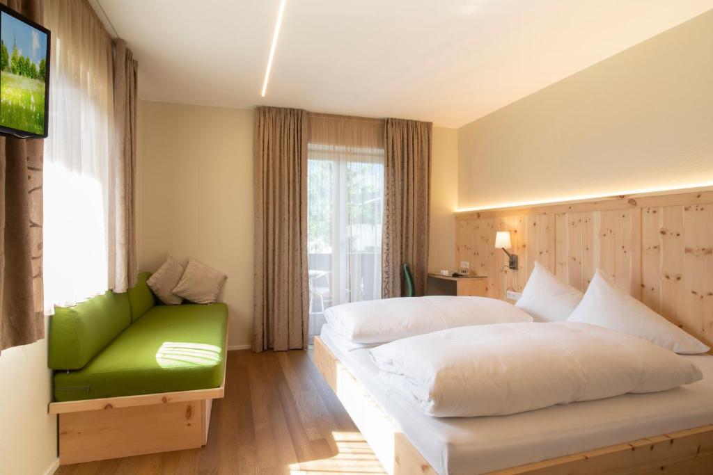 Postel nebo postele na pokoji v ubytování Bed&Breakfast Pension Hilpold
