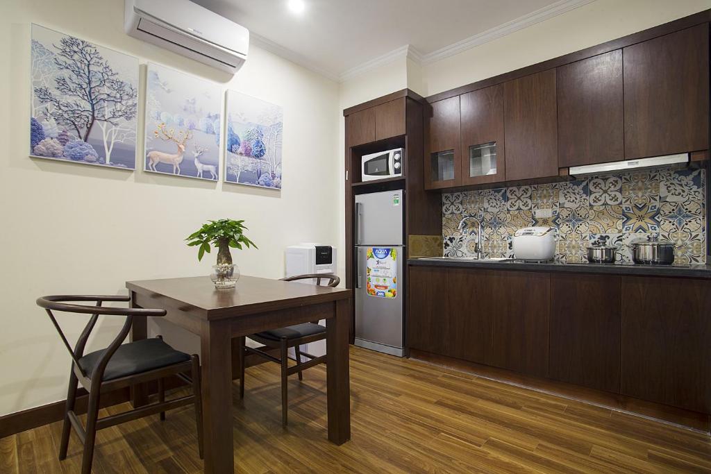 Kuchyň nebo kuchyňský kout v ubytování Newsky Serviced Apartment