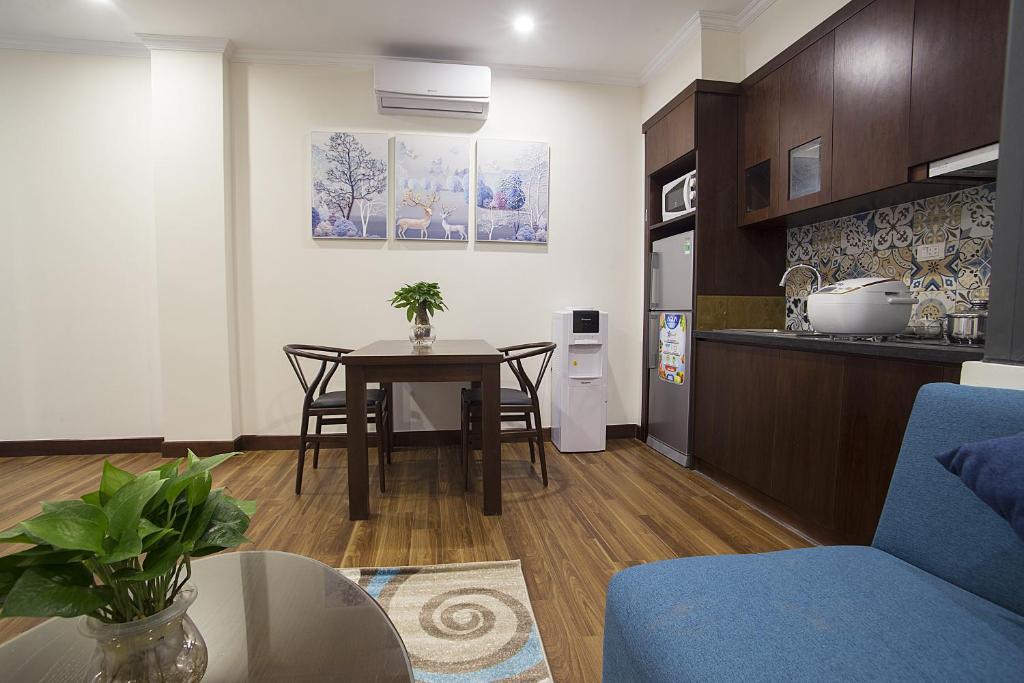 Kuchyň nebo kuchyňský kout v ubytování Newsky Serviced Apartment