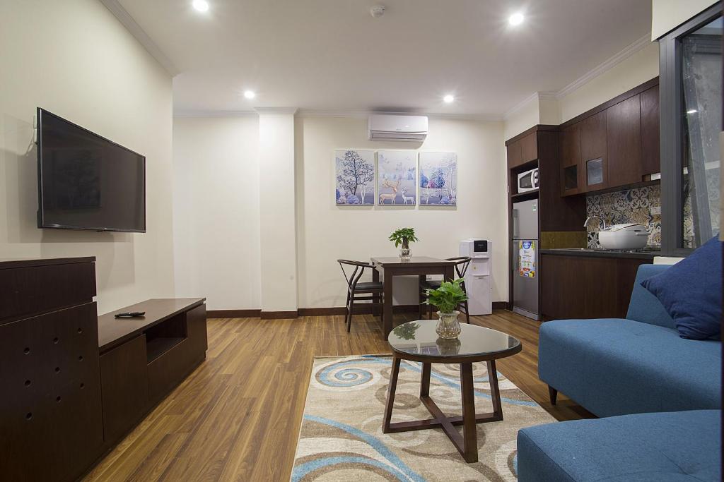 TV a/nebo společenská místnost v ubytování Newsky Serviced Apartment