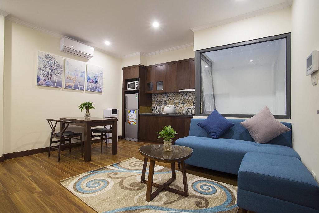 Kuchyň nebo kuchyňský kout v ubytování Newsky Serviced Apartment