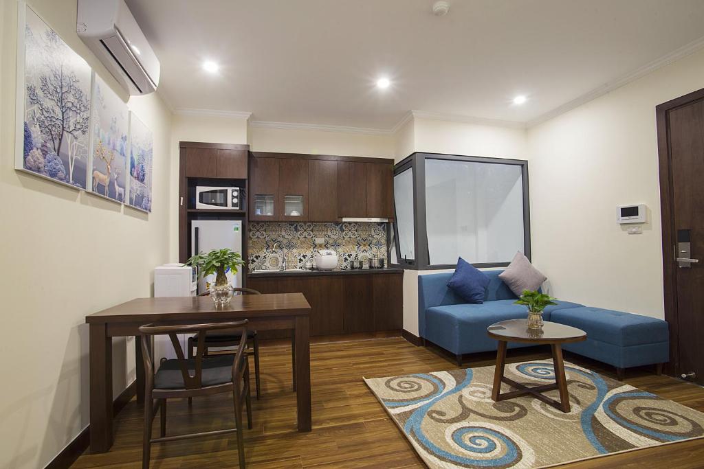 Kuchyň nebo kuchyňský kout v ubytování Newsky Serviced Apartment