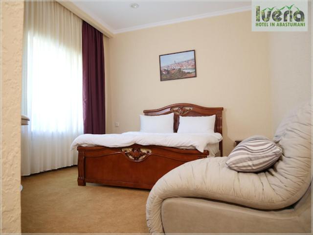 Postel nebo postele na pokoji v ubytování Hotel Iveria