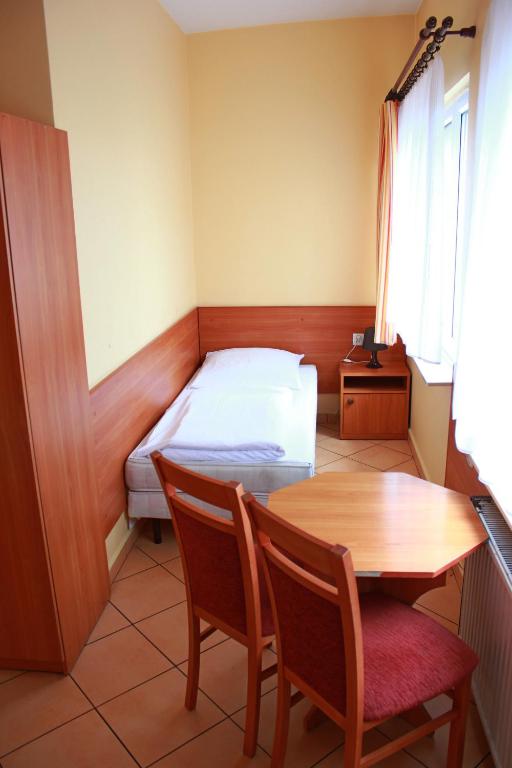 Postel nebo postele na pokoji v ubytování City Hostel