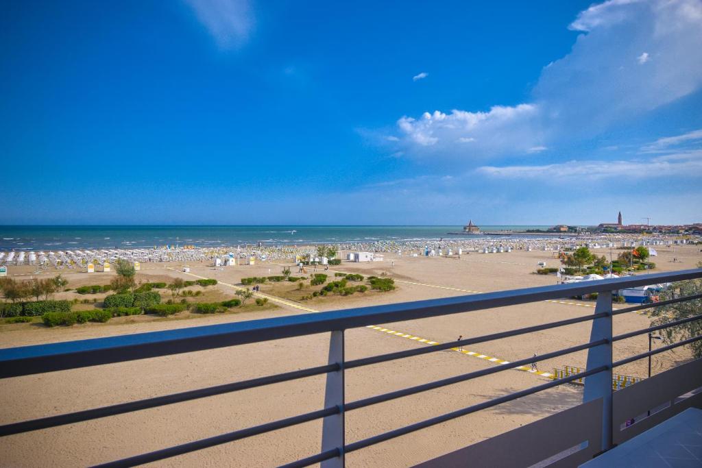 a view of the beach from a balcony of a beach at Hotel Continental in Caorle