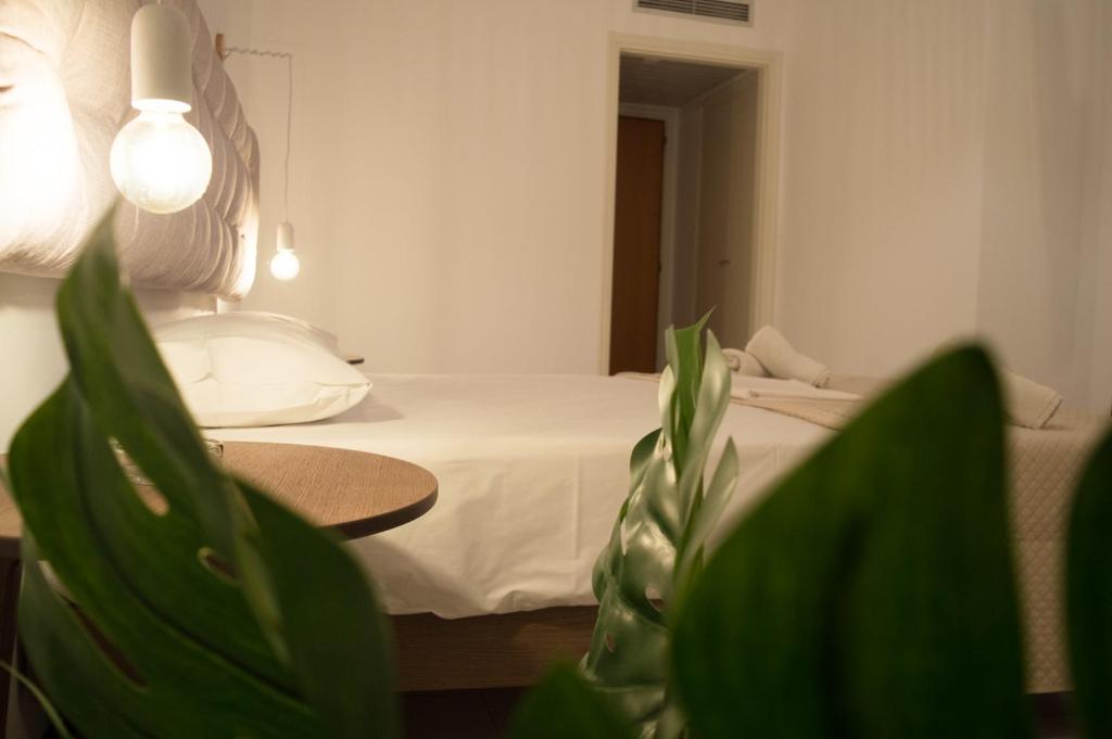 Postel nebo postele na pokoji v ubytování Paradise Beach Hotel