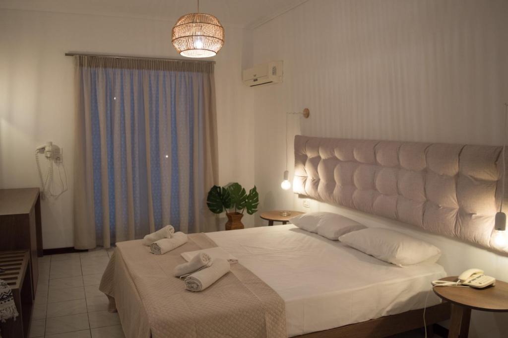 Postel nebo postele na pokoji v ubytování Paradise Beach Hotel
