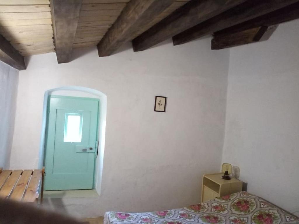 Кровать или кровати в номере Apartman DINKO