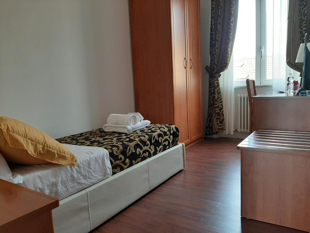 Voodi või voodid majutusasutuse Carpe Diem Ancona toas