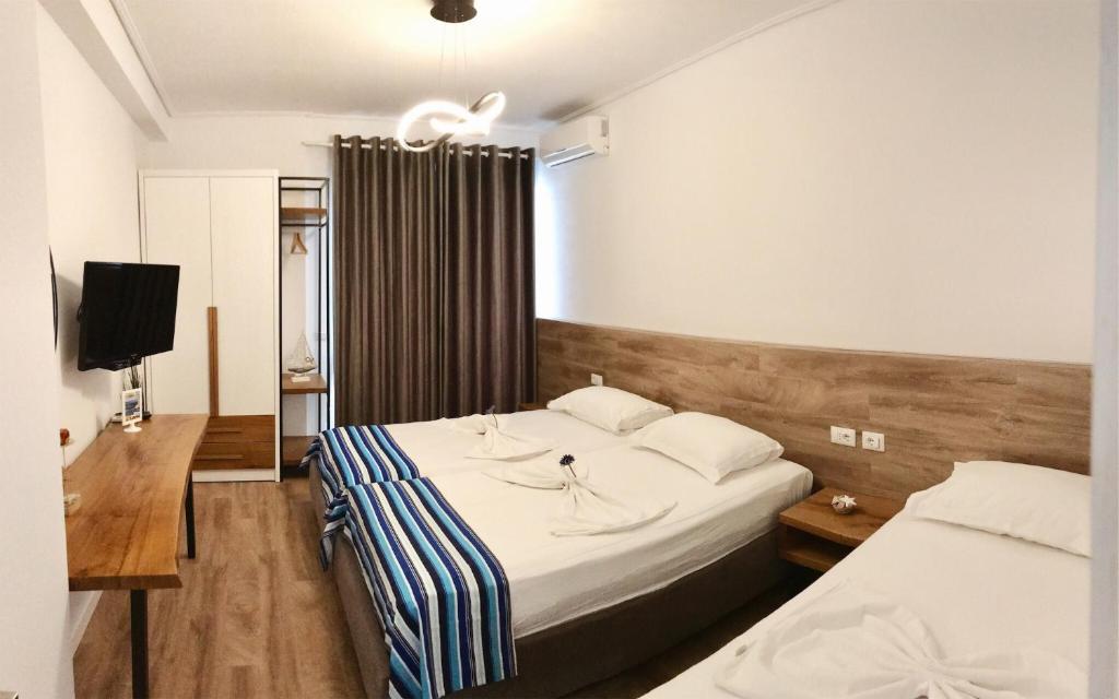 Postel nebo postele na pokoji v ubytování Aquamarine Apartments