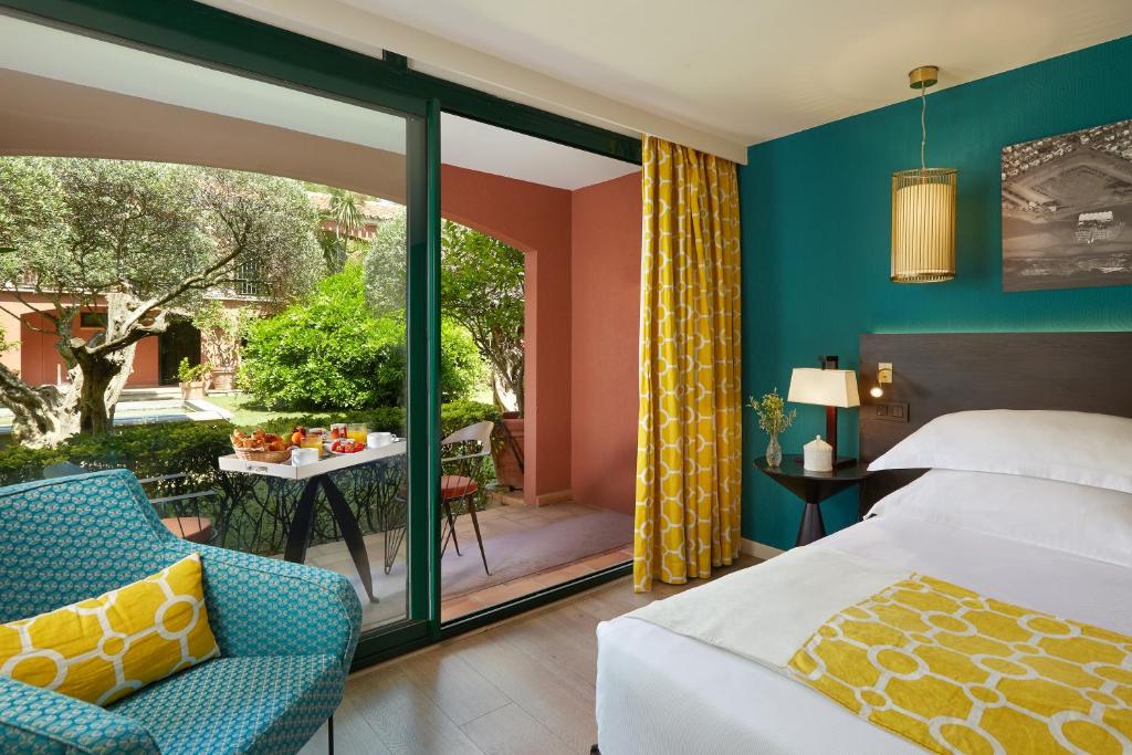 Кровать или кровати в номере Villa Duflot Hôtel & Spa Perpignan