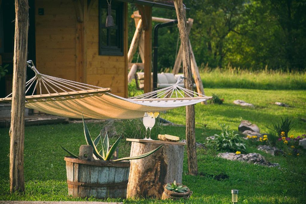 a hammock in a yard next to a house at Father's Land in Rakovica