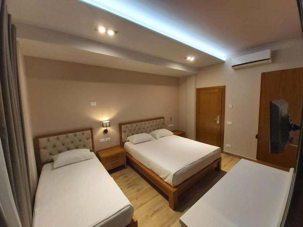 Postel nebo postele na pokoji v ubytování Hotel Pelikan