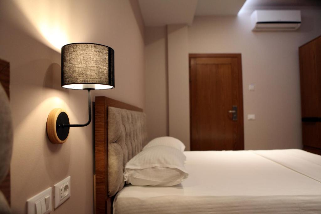 Postel nebo postele na pokoji v ubytování Hotel Pelikan