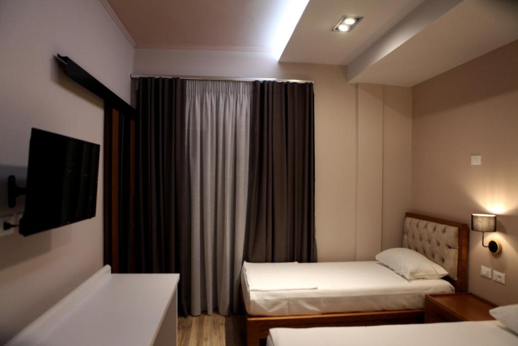 Postel nebo postele na pokoji v ubytování Hotel Pelikan