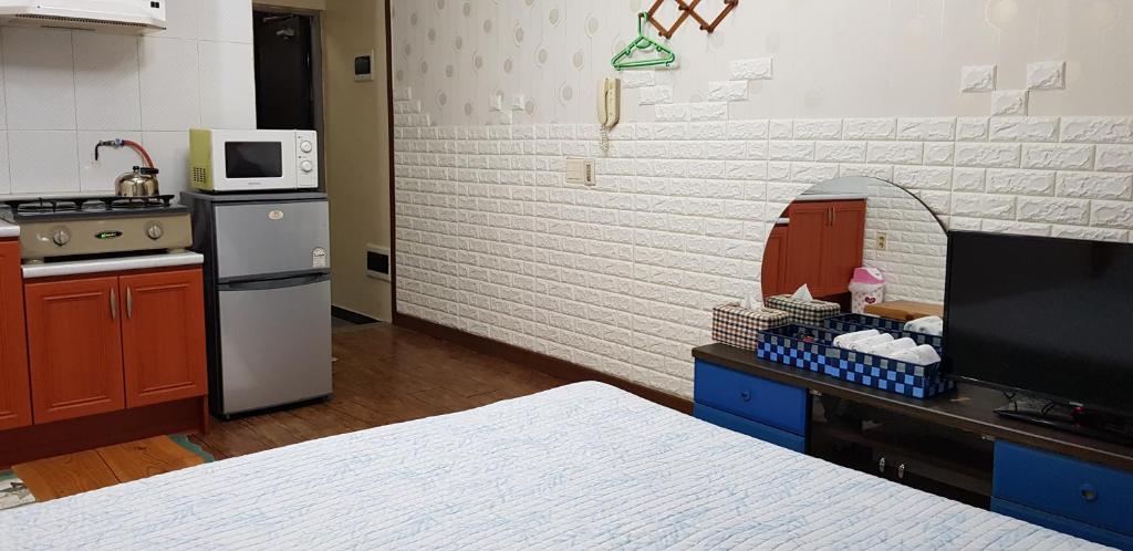Kuchyň nebo kuchyňský kout v ubytování Jun House