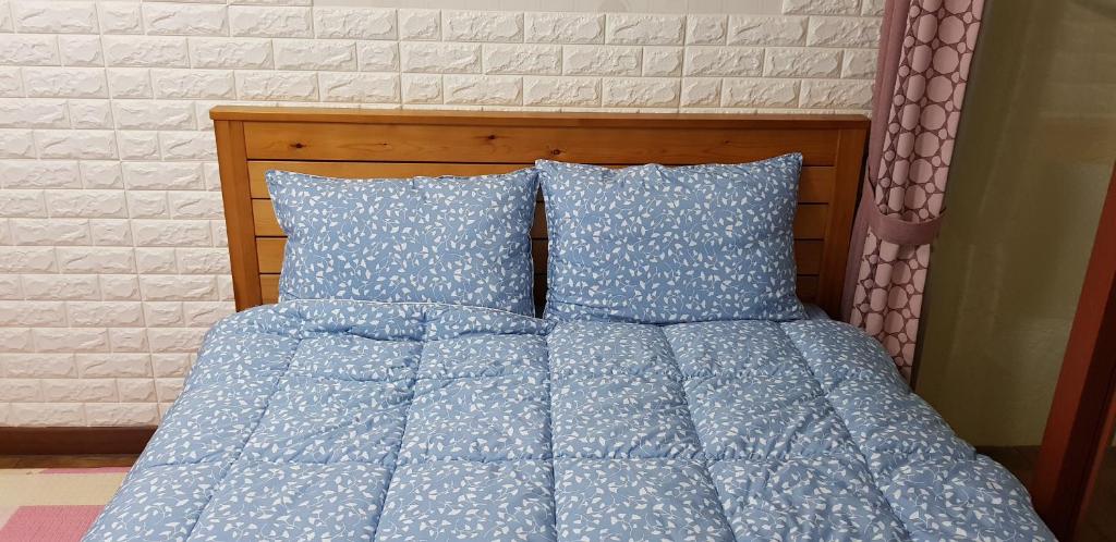Postel nebo postele na pokoji v ubytování Jun House
