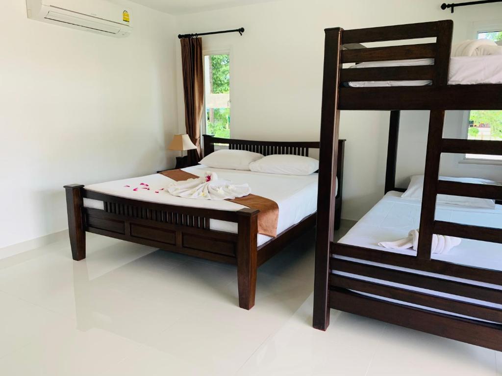 Postel nebo postele na pokoji v ubytování Shangrilah Bungalow