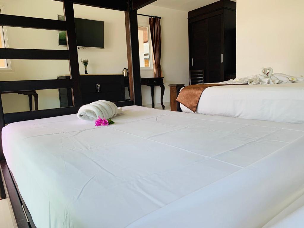 Postel nebo postele na pokoji v ubytování Shangrilah Bungalow