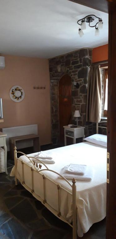 Postel nebo postele na pokoji v ubytování Guest House "Aspasia"