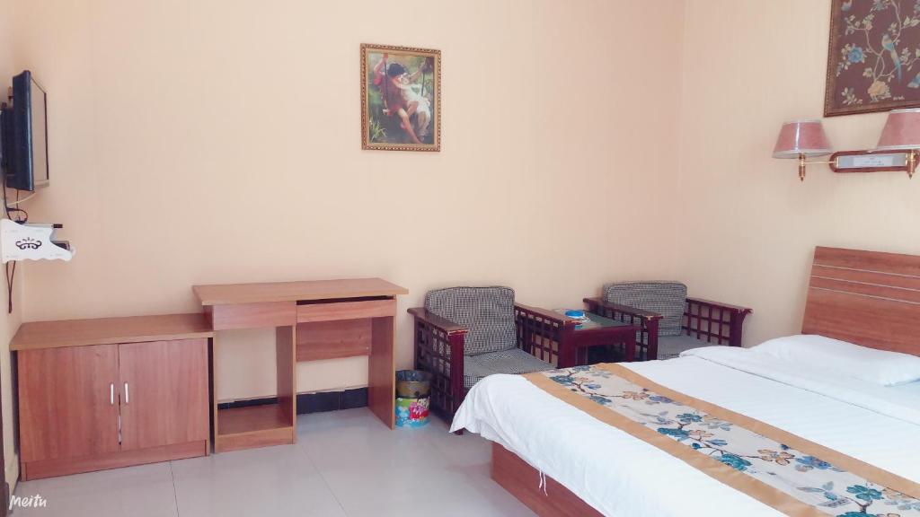 Postel nebo postele na pokoji v ubytování Huashan Gehui Hotel