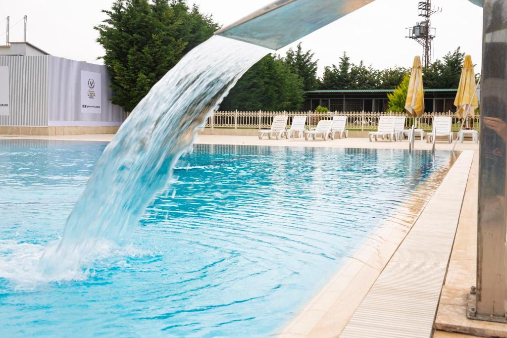 a pool with a water fountain in the middle at Premier Vista Hotel in Silivri