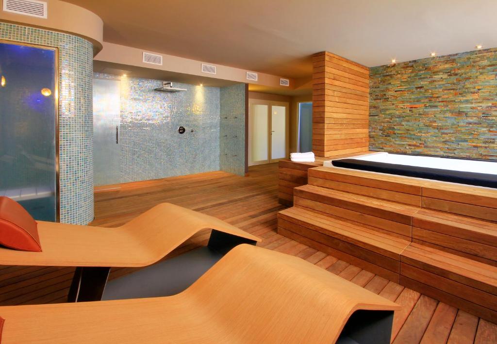 
a room with a wooden floor and wooden walls at Lagaya Apartaments & Spa in Valderrobres
