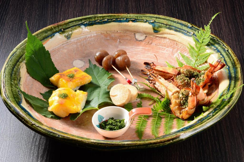 a plate of food with seafood and other foods at Akari no Yado Okabe in Shibukawa