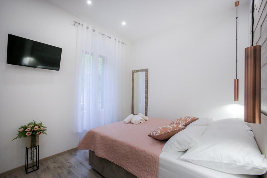 Postel nebo postele na pokoji v ubytování D&D Suites in Split Centre