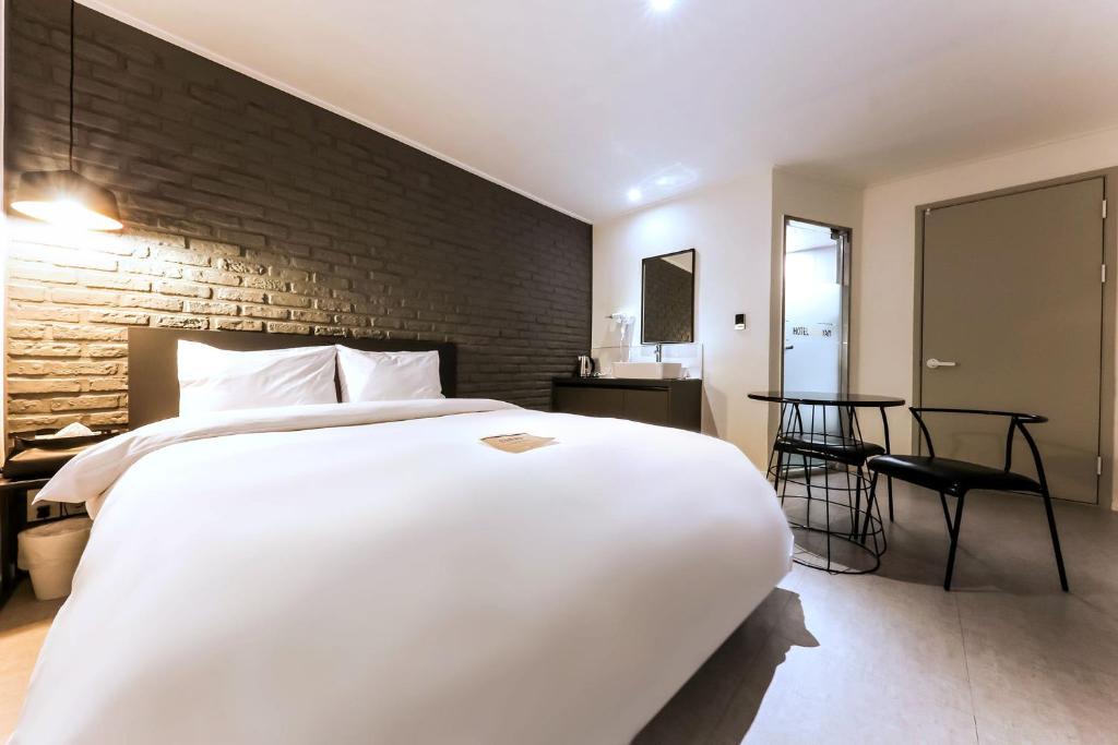 Postel nebo postele na pokoji v ubytování Hotel Yam