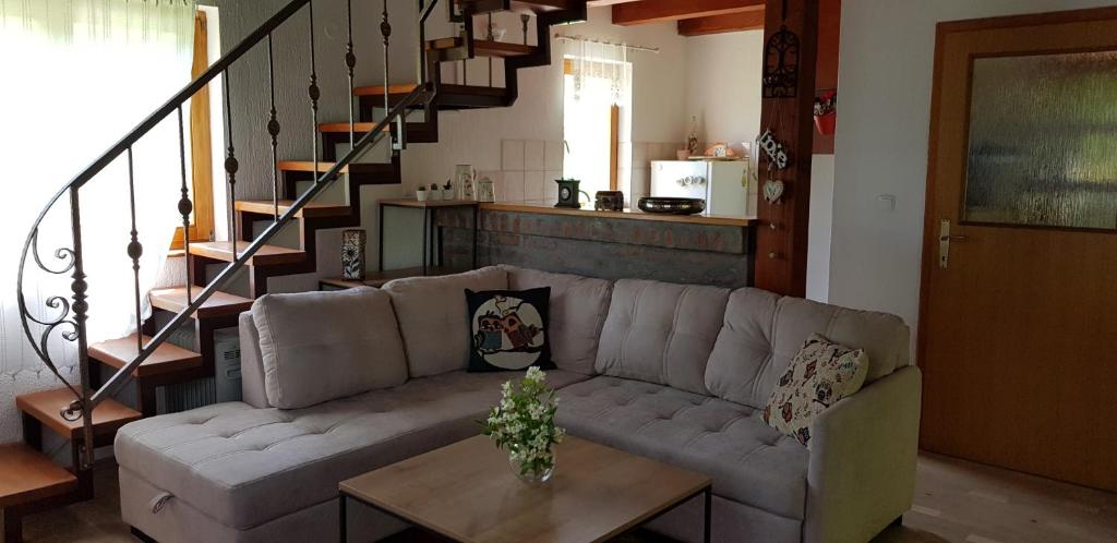 a living room with a couch and a table at Enjoy Visoko in Visoko