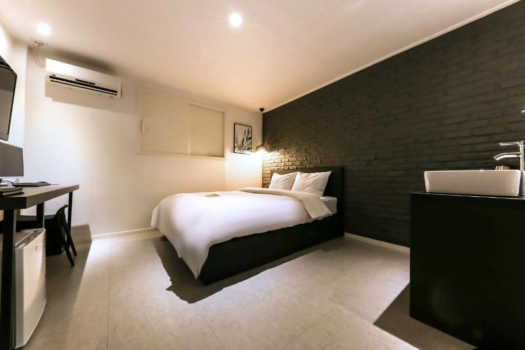 Postel nebo postele na pokoji v ubytování Hotel Yam