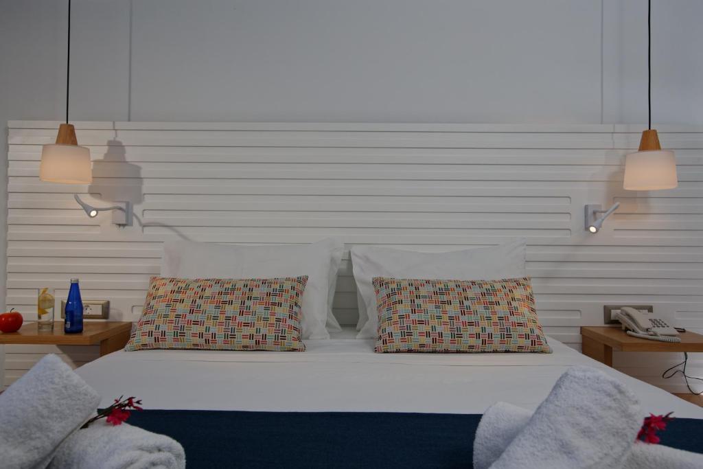 Posteľ alebo postele v izbe v ubytovaní Archipelagos Hotel