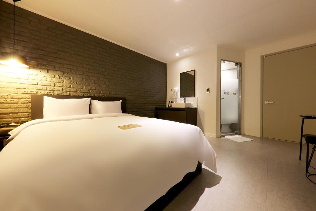 Postel nebo postele na pokoji v ubytování Hotel Yam