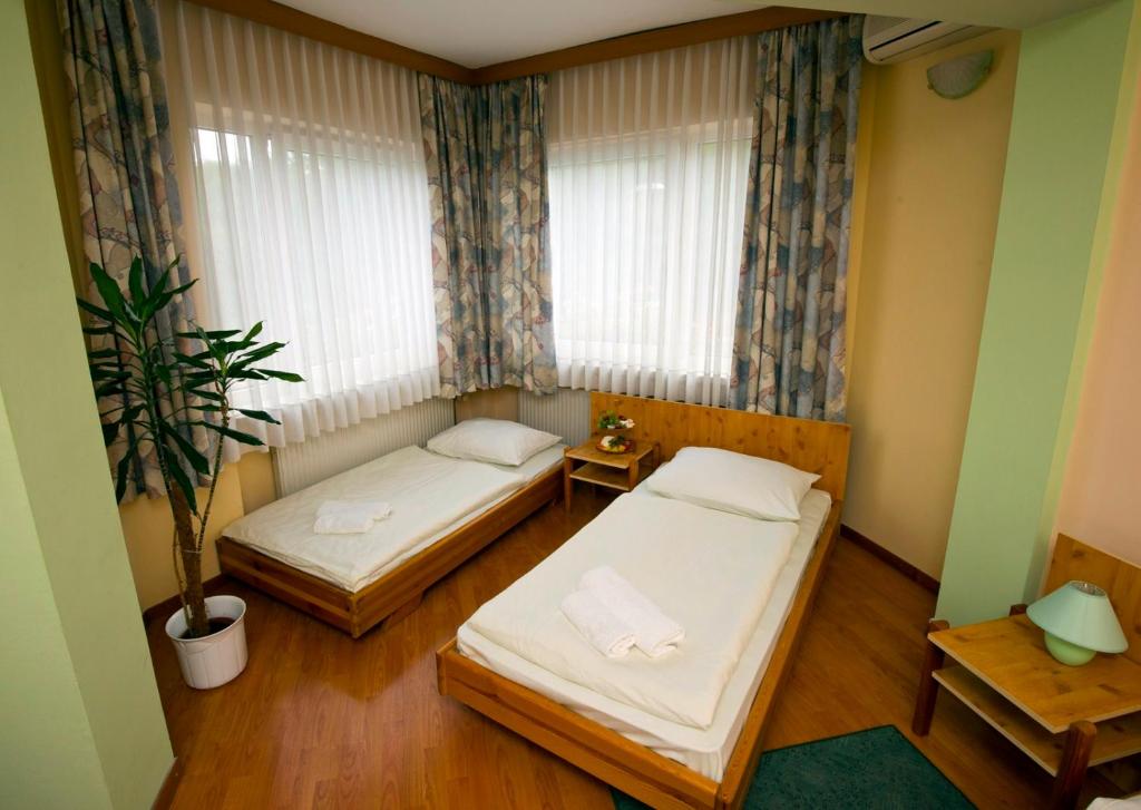 Postel nebo postele na pokoji v ubytování Motel Kod Bakija