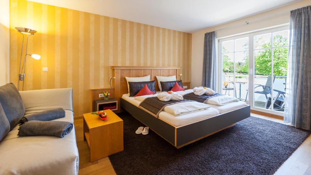 Postel nebo postele na pokoji v ubytování Boutiquehotel zur Winzerstube - Adults Only