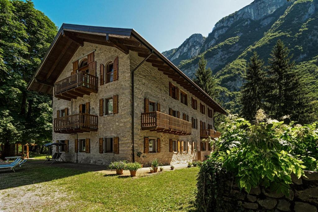 a large building with balconies on the side of it at Villa Paradiso Parolari in Tenno