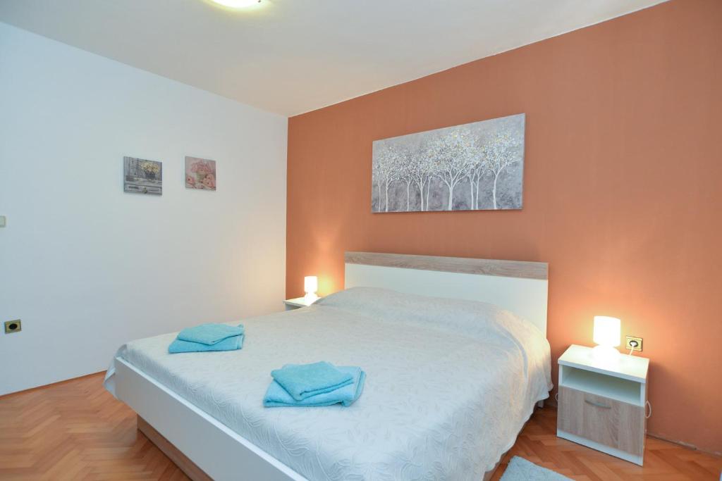 Posteľ alebo postele v izbe v ubytovaní Apartments 408 Fazana