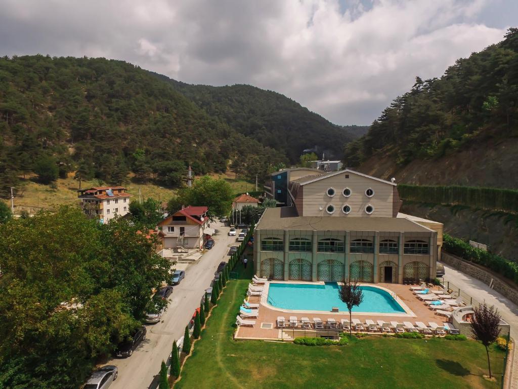 an aerial view of a building with a swimming pool at Sarot Termal Park Resort in Bolu