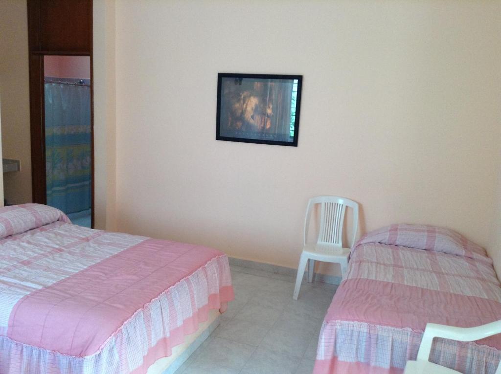 Postel nebo postele na pokoji v ubytování Hotel Tecozautla