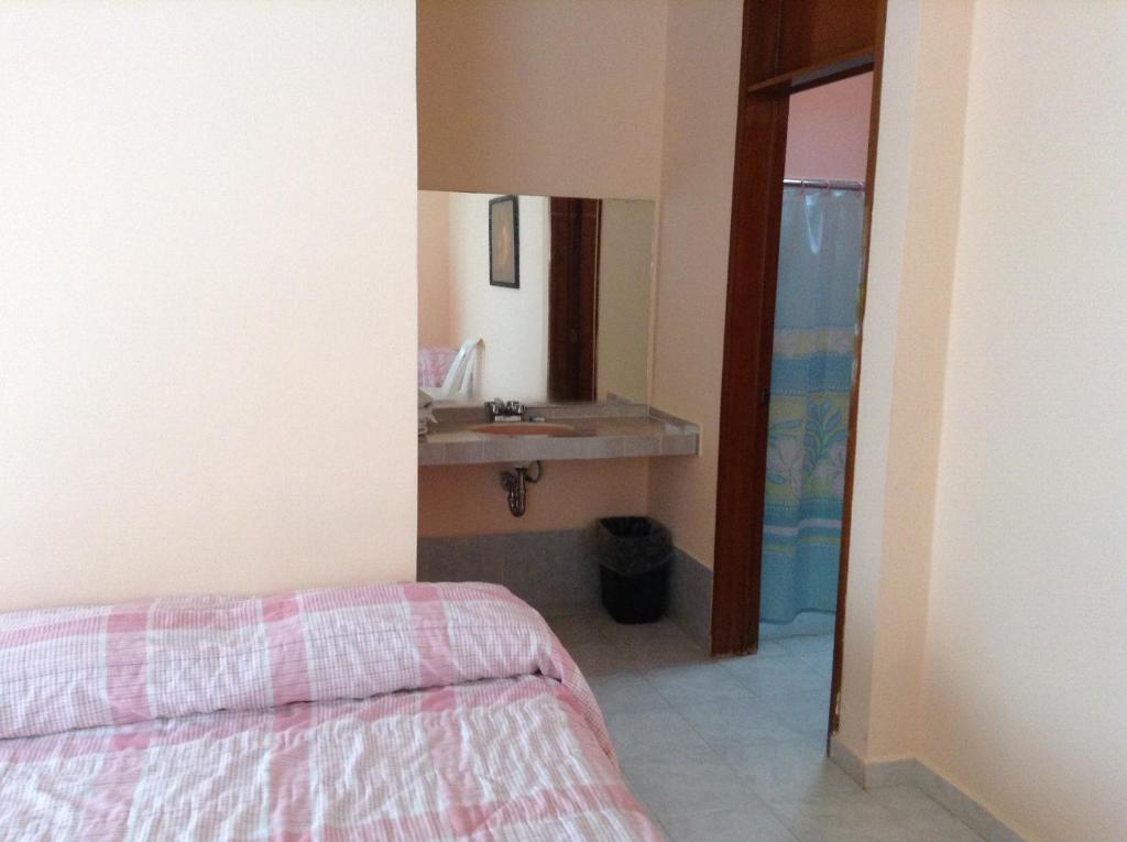 Postel nebo postele na pokoji v ubytování Hotel Tecozautla