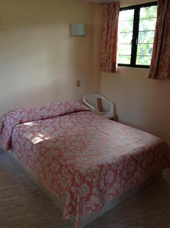 Postel nebo postele na pokoji v ubytování Hotel Tecozautla