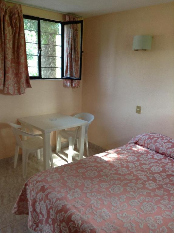 Postel nebo postele na pokoji v ubytování Hotel Tecozautla