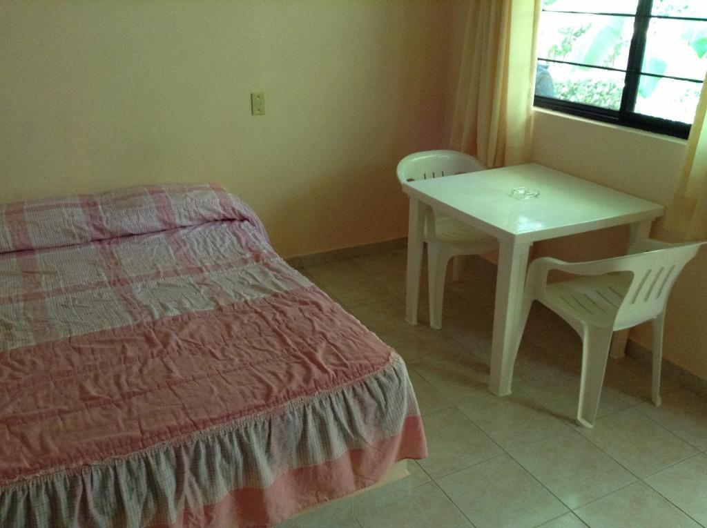 Postel nebo postele na pokoji v ubytování Hotel Tecozautla