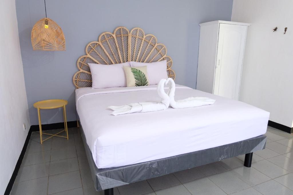 Postel nebo postele na pokoji v ubytování Rarem Bed & Breakfast