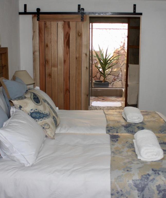 Postel nebo postele na pokoji v ubytování Green Pascua Bed and Breakfast