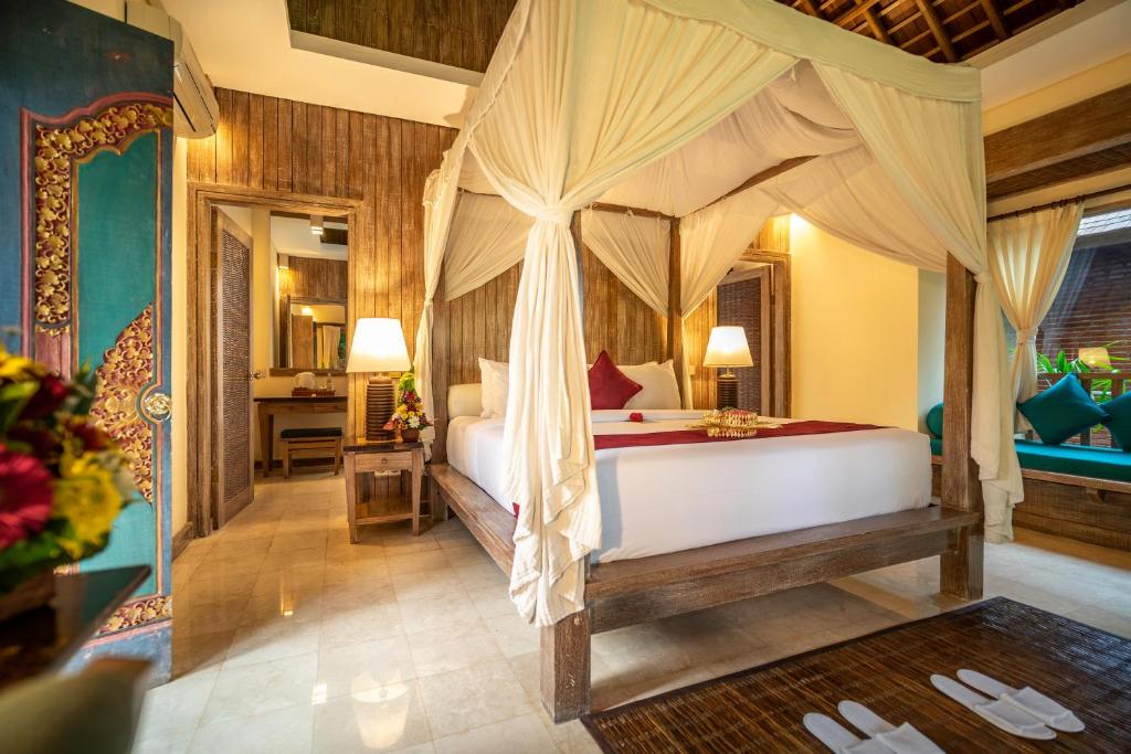 Postel nebo postele na pokoji v ubytování Ananda Ubud Resort